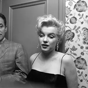 Prints of LOS ANGELES - MARCH 3: Movie star Marilyn Monroe hosts a press party held at her home on March 3, 1956 in Los Angeles, California. (Photo by Earl Leaf/Michael Ochs Archives/Getty Images) Marilyn Monroe: The Iconic Muse Prints: Press Party At Marilyn's