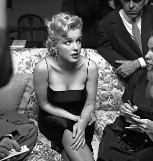 Prints of LOS ANGELES - MARCH 3: Movie star Marilyn Monroe hosts a press party held at her home on March 3, 1956 in Los Angeles, California. (Photo by Earl Leaf/Michael Ochs Archives/Getty Images) Marilyn Monroe: The Iconic Muse Prints: Press Party At Marilyn's