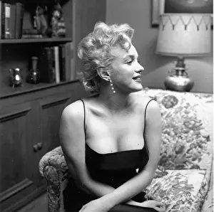 Prints of LOS ANGELES - MARCH 3: Movie star Marilyn Monroe hosts a press party held at her home on March 3, 1956 in Los Angeles, California. (Photo by Earl Leaf/Michael Ochs Archives/Getty Images) Marilyn Monroe: The Iconic Muse Prints: Press Party At Marilyn's