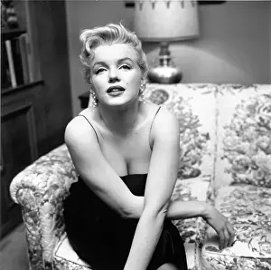 Prints of LOS ANGELES - MARCH 3: Movie star Marilyn Monroe hosts a press party held at her home on March 3, 1956 in Los Angeles, California. (Photo by Earl Leaf/Michael Ochs Archives/Getty Images) Marilyn Monroe: The Iconic Muse Prints: Press Party At Marilyn's