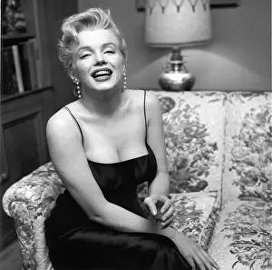 Prints of LOS ANGELES - MARCH 3: Movie star Marilyn Monroe hosts a press party held at her home on March 3, 1956 in Los Angeles, California. (Photo by Earl Leaf/Michael Ochs Archives/Getty Images) Marilyn Monroe: The Iconic Muse Prints: Press Party At Marilyn's