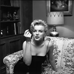 Prints of LOS ANGELES - MARCH 3: Movie star Marilyn Monroe hosts a press party held at her home on March 3, 1956 in Los Angeles, California. (Photo by Earl Leaf/Michael Ochs Archives/Getty Images) Marilyn Monroe: The Iconic Muse Prints: Press Party At Marilyn's