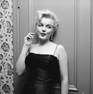 Prints of LOS ANGELES - MARCH 3: Movie star Marilyn Monroe hosts a press party held at her home on March 3, 1956 in Los Angeles, California. (Photo by Michael Ochs Archives/Getty Images) Marilyn Monroe: The Iconic Muse Prints: Press Party At Marilyn's