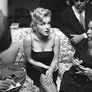 Prints of LOS ANGELES - MARCH 3: Movie star Marilyn Monroe hosts a press party held at her home on March 3, 1956 in Los Angeles, California. (Photo by Michael Ochs Archives/Getty Images) Marilyn Monroe: The Iconic Muse Prints: Press Party At Marilyn's