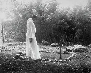Priest at a Grave Site