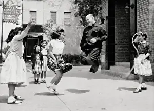 Priest Jumps Rope W/ Chinese Girls