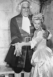 Retiree Prints: Primo Carnera, Audrey Dalton Compare Hands