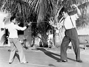 Primo Carnera Fencing With a Friend