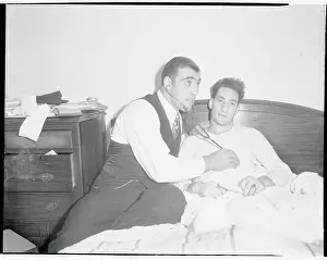 Primo Carnera Holding Stethoscope to Art Lasky