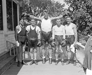 Tall Prints: Primo Carnera Stands with Sparring Partners