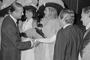 Prince Philip Clasping Hands with Lauren Bacall