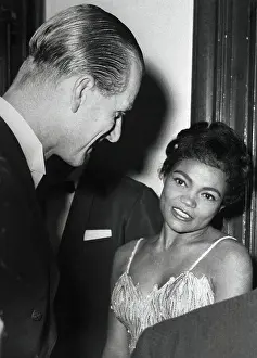 Prints of (Original Caption) Captivating Art Prints Celebrating the Iconic Performer’s Legacy: Prince Philip Talking with Eartha Kitt