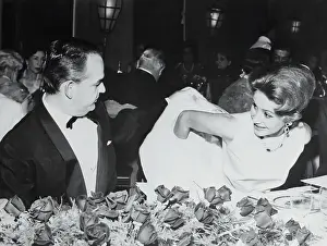 Prince Rainier III Helping Athina Onassis Remove Her Coat