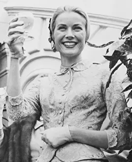 Princess Grace Raising Glass