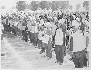 Prisoners Holding Up Their Chains