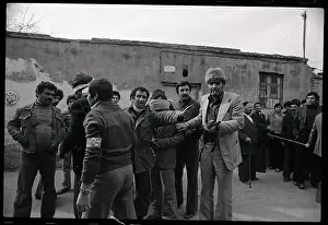 Pro-Khomeini Militia Take a Prisoner in for Questioning