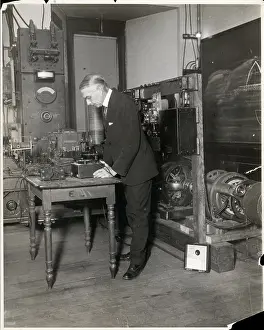 Prof Slichter Looks At Motor In Lab