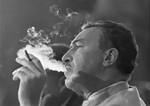 Profile of Adam Clayton Powell Smoking Cigarette