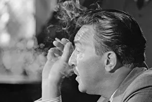 Profile Portrait of Adam Clayton Powell Smoking