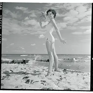 Starfish Prints: Profile of Young Woman Posing with Starfish in Hand