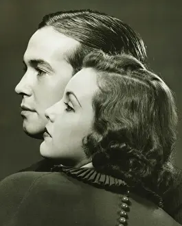Sleek Hair Prints: Profiles of couple posing in studio, (B&W), close-up, portrait