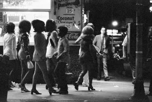 Miniskirt Prints: Prostitutes Walking on a Sidewalk at Night