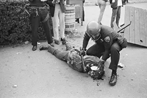 Protester Lying Injured on Sidewald