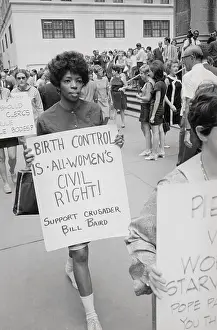 Protesters Carrying Signs on Birth Control