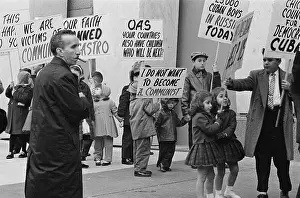 Protesters Carrying Signs Against Communism in Cuba