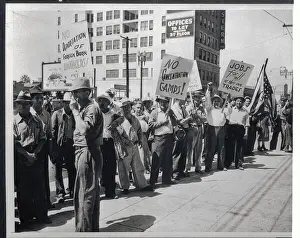 Protesters Carrying Signs in Street