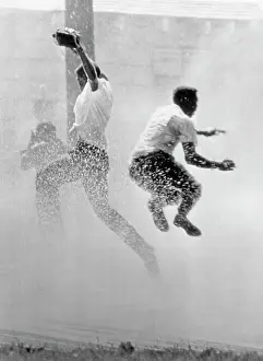 Fire Hose Prints: Protesters Sprayed with Fire Hose