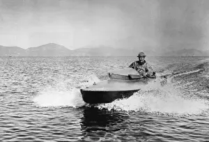 Motorboat Prints: Puccini Piloting Motorboat