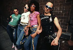 Prints of Portrait of punk fashion designers Pam, Craig, Marsha, and Jim as they pose in an assortment of their designs on Staple Street in Tribeca, New York, New York, May 27, 1977 Fashion Trends Through Time Prints: Punk Fashion Designers Wear Their Creations