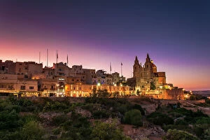 Images Dated 21st September 2017: A purple sunset over the village of Mellieha, Malta
