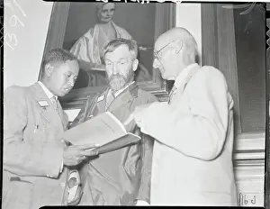 Quaker Attendees Reading Literature