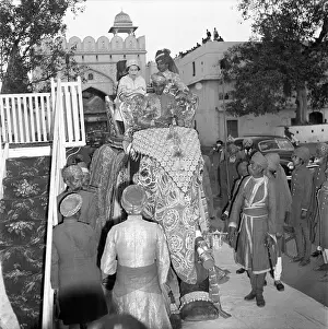 Prints of JAIPUR, INDIA - JANUARY 22: Queen Elizabeth II and the Maharaja of Jaipur, Sawai Man Singh II, ride on an elephant in Jaipur, India, January 22nd 1961. (Photo by Michael Ochs Archives/Getty Images) Queen Elizabeth II Prints: Queen Elizabeth II Rides An Elephant
