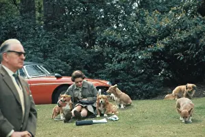 Queen Elizabeth II Sitting with Dogs