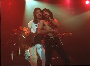 Prints of British rock band Queen perform in concert with Freddie Mercury wearing black leotard at the Forum on December 22, 1977 in Inglewood, California Queen Unleashed: Queen Performing in LA