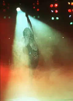 Prints of British rock band Queen perform in concert with Freddie Mercury wearing black leotard at the Forum on December 22, 1977 in Inglewood, California Queen Unleashed: Queen Performing in LA