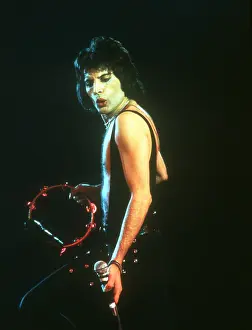 Prints of British rock band Queen perform in concert with Freddie Mercury wearing black leotard at the Forum on December 22, 1977 in Inglewood, California Queen Unleashed: Queen Performing in LA