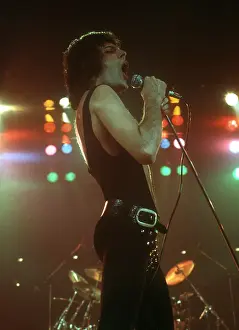 Prints of British rock band Queen perform in concert with Freddie Mercury wearing black leotard at the Forum on December 22, 1977 in Inglewood, California Queen Unleashed: Queen Performing in LA