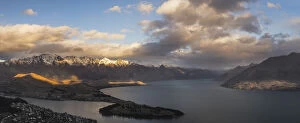 Queenstown on Lake Wakatipu and The Remarkbales mountain range at sunset, Otago Region, South Island, New Zealand