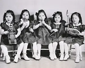 Marie Dionne Prints: The Quintuplets Playing with Instruments