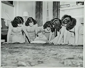 The Quintuplets Playing with New Baby