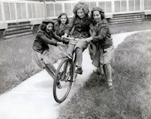 Marie Dionne Prints: The Quintuplets Riding a Bicycle