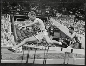 R F Ault Jumping over Hurdle