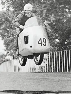 R. McIntyre Driving Norton Motorcycle
