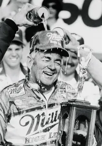Nascar Prints: Race Car Driver Bobby Allison Holding Large Trophy