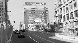 Prints of LONG BEACH, CALIFORNIA - SEPTEMBER 28 : Race cars drive up Pine Avenue then turn Right onto Ocean Blvd Legends of the Track: Race Cars in Streets at Inaugural Grand Prix of Long Beach 1975