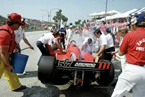 Prints of LONG BEACH, CALIFORNIA - APRIL 13 : Racer Randy Lanier (57) Lola T-900 C racer got the Fire Crews attention during a pit stop at the Toyota Long Beach Grand Prix race, April 13, 1985 in Long Beach Legends of the Track: Racer Randy Lanier car smokes on Pit Row at Long Beach Grand Prix Race 1985